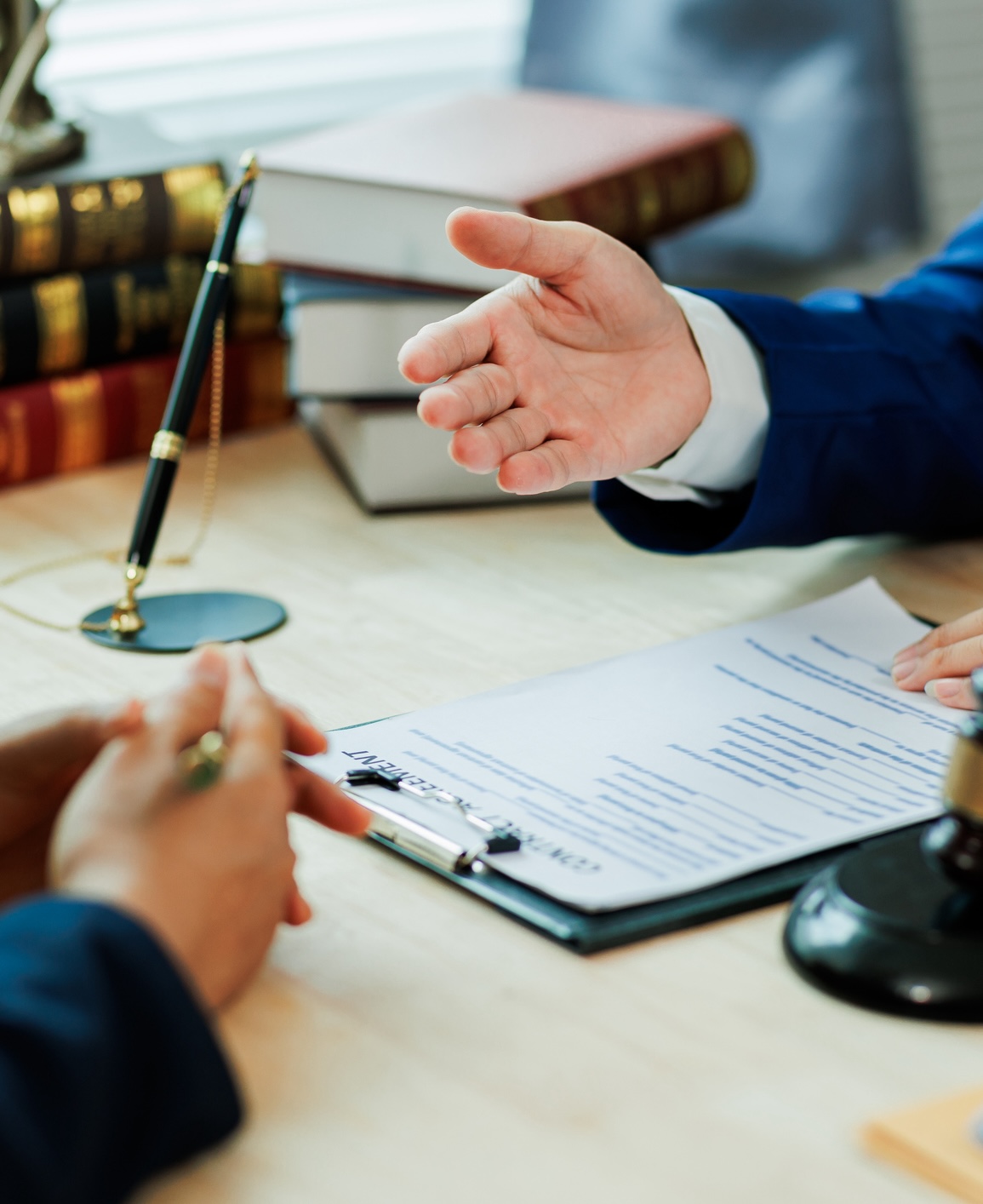 A client meets with a lawyer to discuss a legal case and seek professional representation